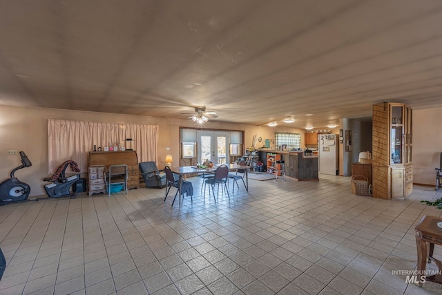 dining room featuring ceiling fan and light tile patterned floors