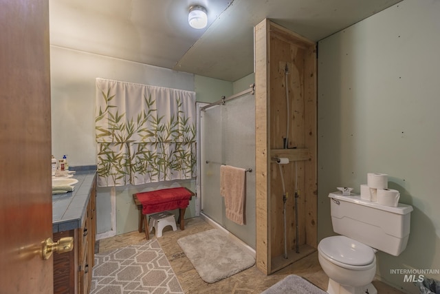 702 N D St, Grangeville, ID 83530 - full bath featuring toilet, vanity, and a shower
