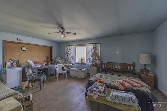 702 N D St, Grangeville, ID 83530 - bedroom with a ceiling fan, concrete flooring, and fridge