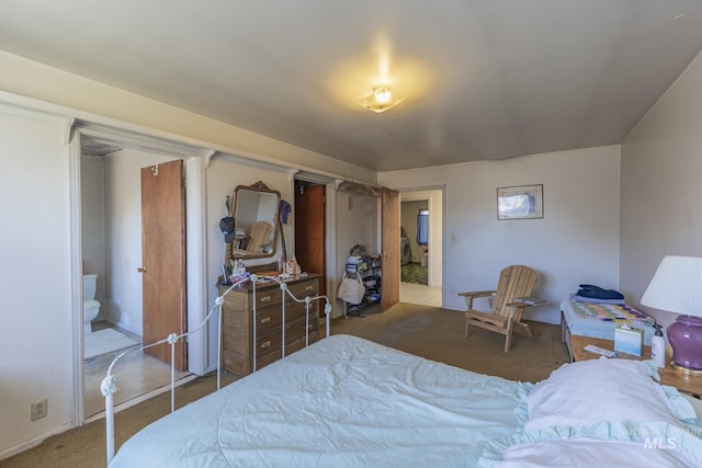 702 N D St, Grangeville, ID 83530 - carpeted bedroom featuring ensuite bath