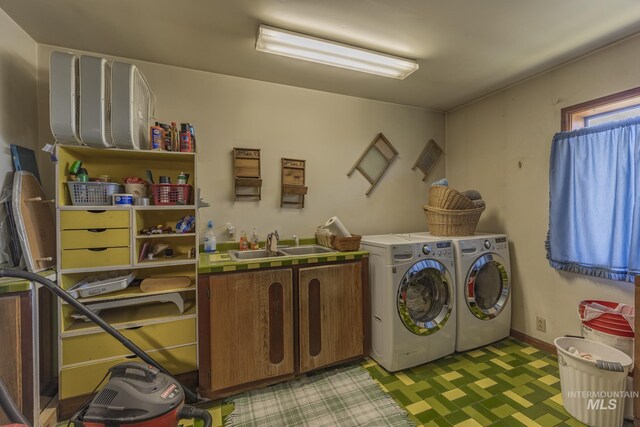 702 N D St, Grangeville, ID 83530 - laundry area with cabinet space, separate washer and dryer, and light flooring