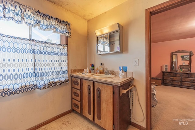 bathroom featuring vanity and a wealth of natural light