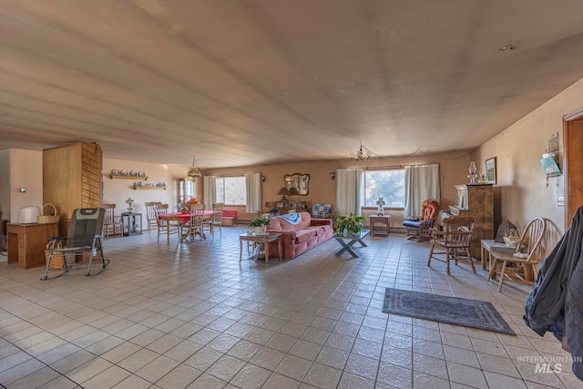 tiled living room with a healthy amount of sunlight