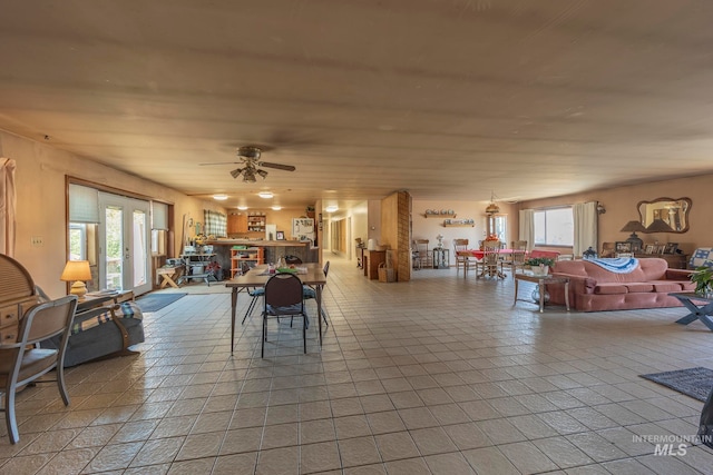 dining room featuring ceiling fan and a healthy amount of sunlight