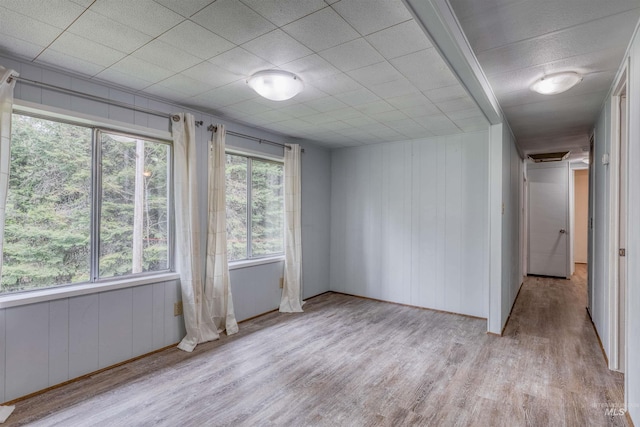unfurnished room with wood finished floors
