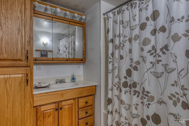 full bathroom featuring vanity and shower / bath combo with shower curtain