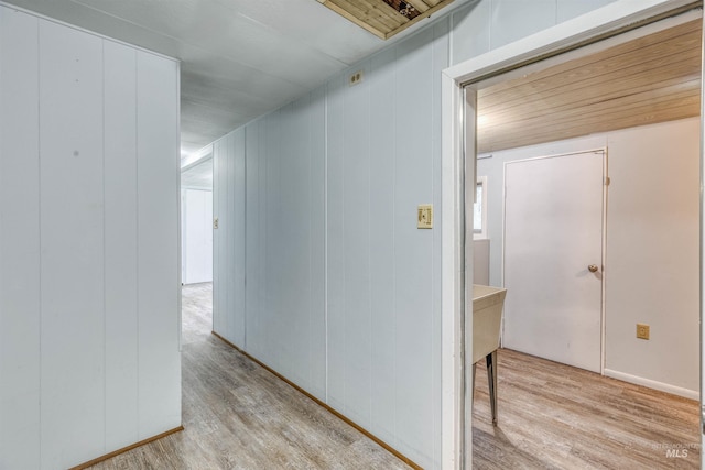 hallway with light wood-style floors