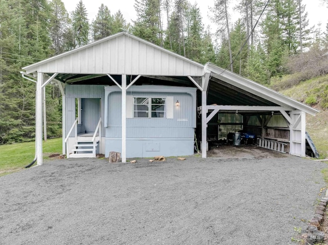 view of front of house featuring a detached carport and covered porch