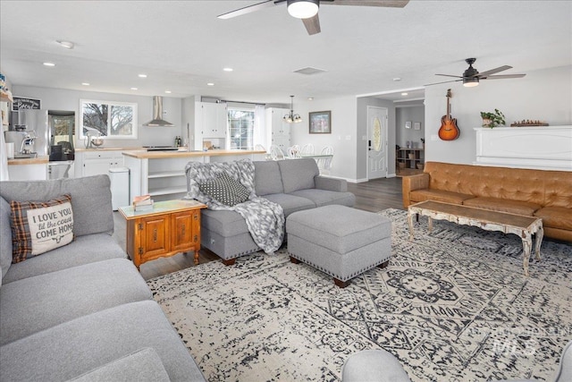 living area with baseboards, recessed lighting, dark wood-style flooring, and ceiling fan