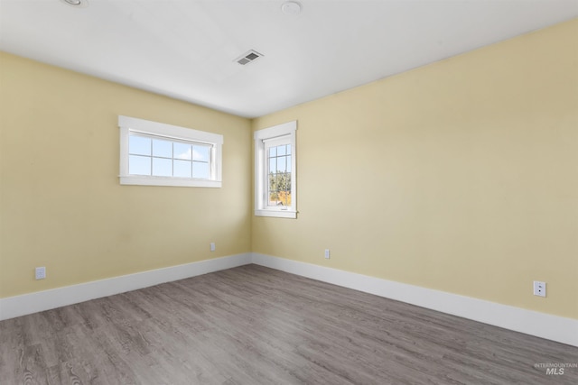 spare room featuring light wood-type flooring