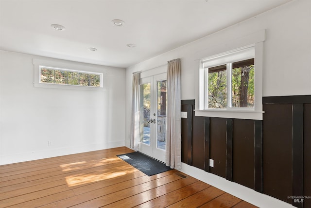 doorway to outside with french doors and hardwood / wood-style flooring