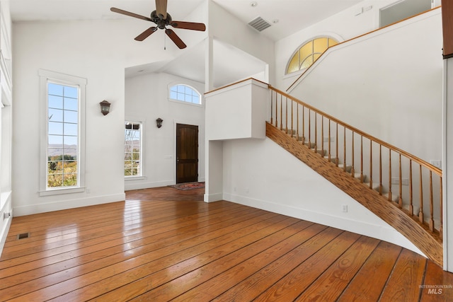 entrance foyer with high vaulted ceiling, ceiling fan, and hardwood / wood-style floors