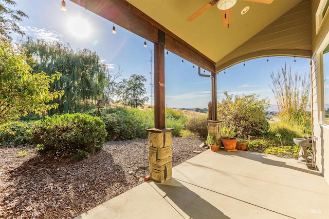 view of patio featuring ceiling fan