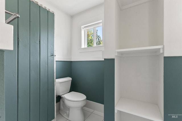 bathroom with tile patterned floors and toilet