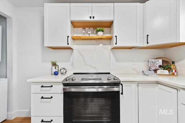 916 N 32nd St, Boise, ID 83702 - kitchen with stainless steel electric range, light countertops, and white cabinets