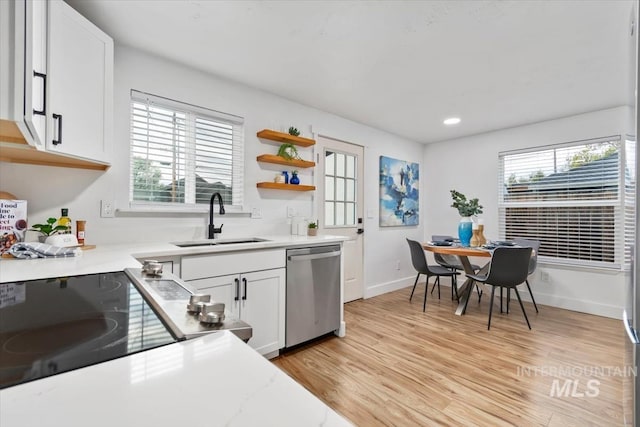 916 N 32nd St, Boise, ID 83702 - kitchen featuring dishwasher, white cabinetry, a sink, and light wood-style flooring