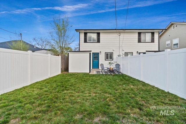 916 N 32nd St, Boise, ID 83702 - rear view of property featuring a fenced backyard and a lawn
