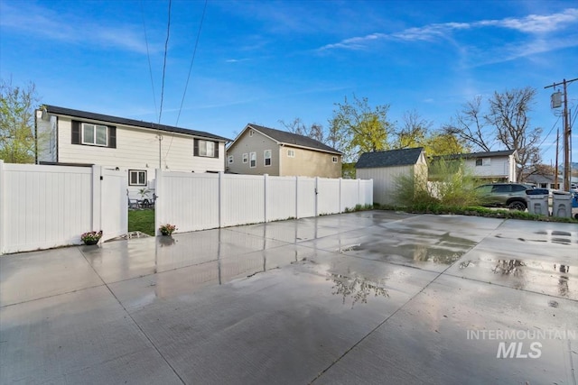 916 N 32nd St, Boise, ID 83702 - view of patio / terrace featuring a shed, a residential view, an outdoor structure, and fence