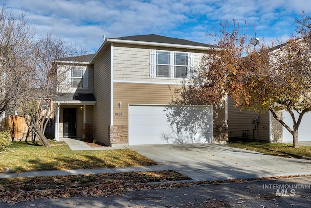 view of front facade with a front yard and a garage