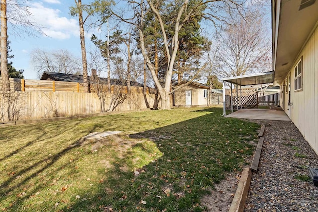 view of yard featuring an outbuilding and a fenced backyard