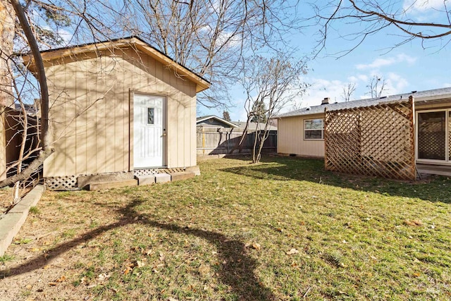 view of yard with a fenced backyard and an outdoor structure