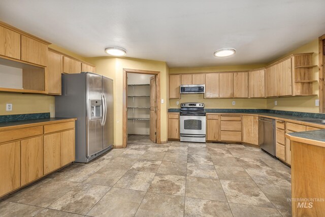 kitchen featuring wood ceiling, sink, kitchen peninsula, light brown cabinetry, and stainless steel dishwasher