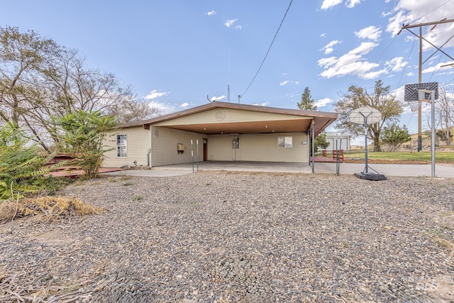 rear view of property with a carport