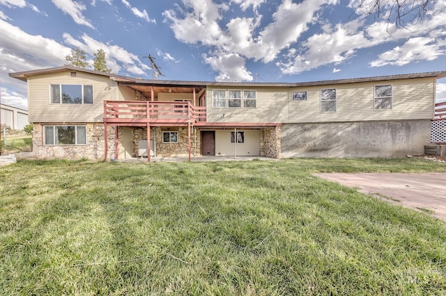 exterior space with a lawn and a wooden deck