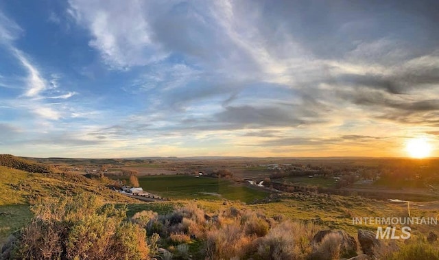 nature at dusk featuring a rural view