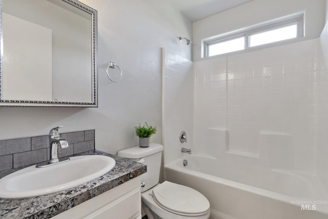 bathroom featuring washtub / shower combination, tasteful backsplash, toilet, and vanity