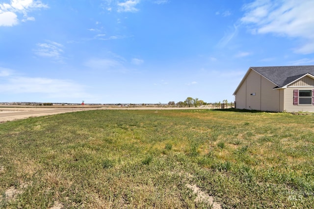 view of yard with a rural view