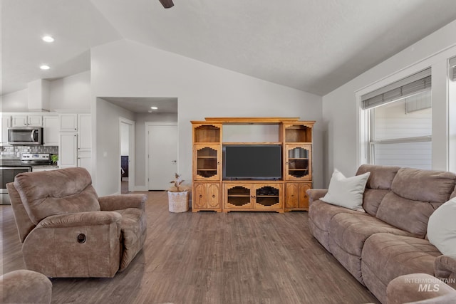 living area featuring wood finished floors, high vaulted ceiling, recessed lighting, and ceiling fan