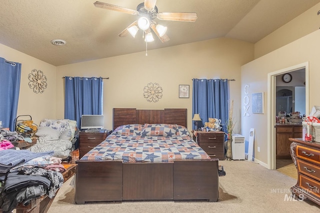 carpeted bedroom featuring ceiling fan and lofted ceiling