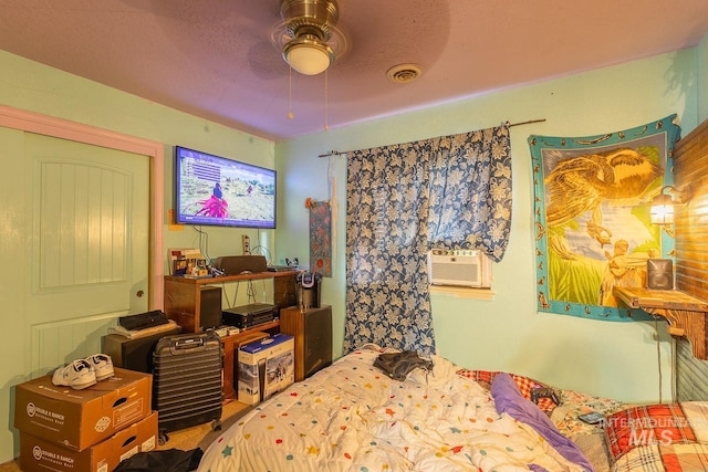 bedroom featuring ceiling fan and cooling unit