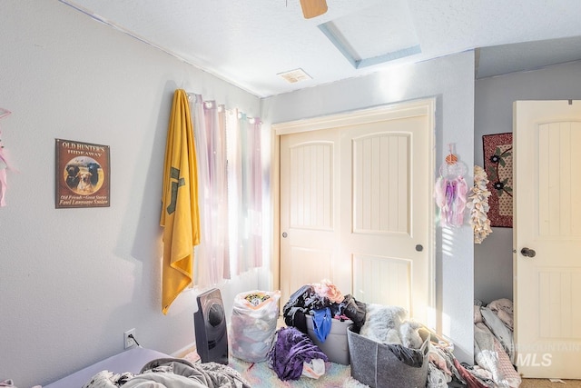 bedroom featuring ceiling fan and a closet