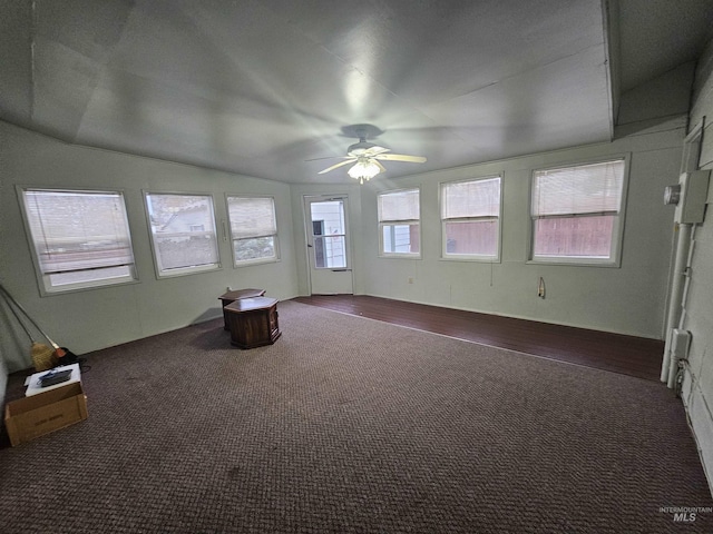 unfurnished sunroom with ceiling fan and lofted ceiling