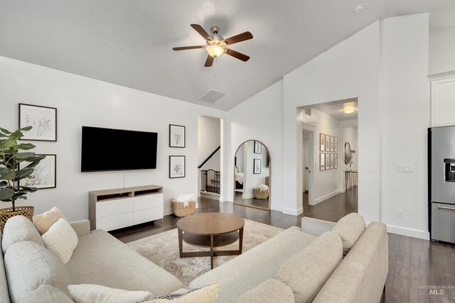 2935 NW 8th Ave, Meridian, ID 83646 - living room with ceiling fan, wood finished floors, baseboards, stairs, and high vaulted ceiling