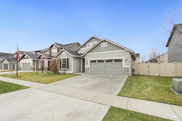 2935 NW 8th Ave, Meridian, ID 83646 - craftsman house with board and batten siding, an attached garage, stone siding, driveway, and a gate