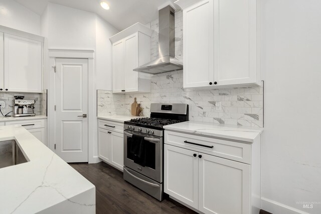 2935 NW 8th Ave, Meridian, ID 83646 - kitchen featuring gas stove, wall chimney exhaust hood, decorative backsplash, white cabinets, and light stone counters
