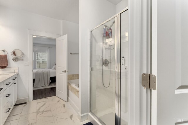 2935 NW 8th Ave, Meridian, ID 83646 - ensuite bathroom featuring a shower stall, marble finish floors, vanity, a garden tub, and baseboards