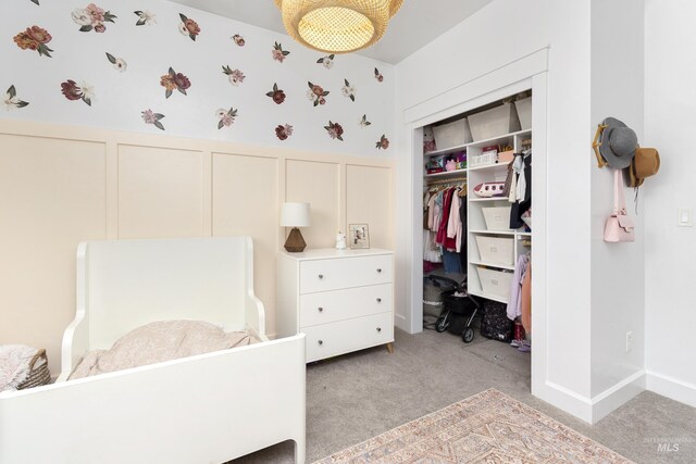 2935 NW 8th Ave, Meridian, ID 83646 - bedroom featuring a decorative wall, a wainscoted wall, light colored carpet, a closet, and wallpapered walls