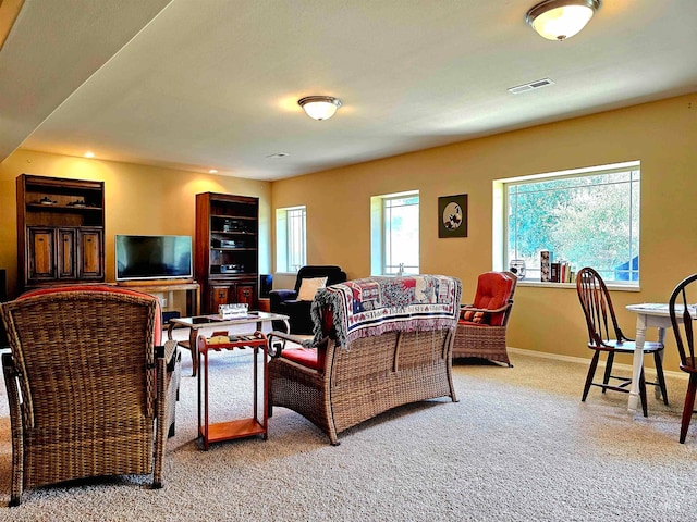 carpeted living room featuring a wealth of natural light