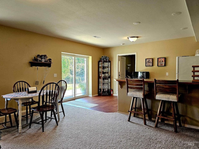 view of carpeted dining area