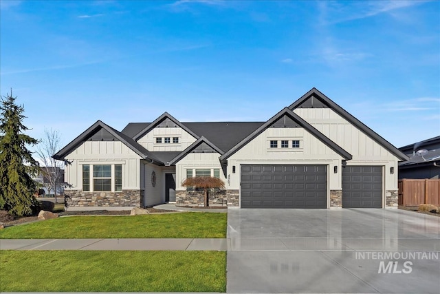 view of front of property with a garage and a front lawn