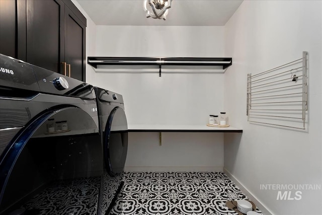 laundry room with cabinets, separate washer and dryer, and tile patterned flooring