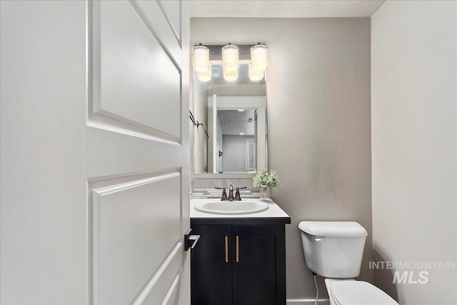 bathroom with vanity and toilet