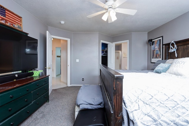 bedroom featuring a textured ceiling, ceiling fan, and carpet flooring