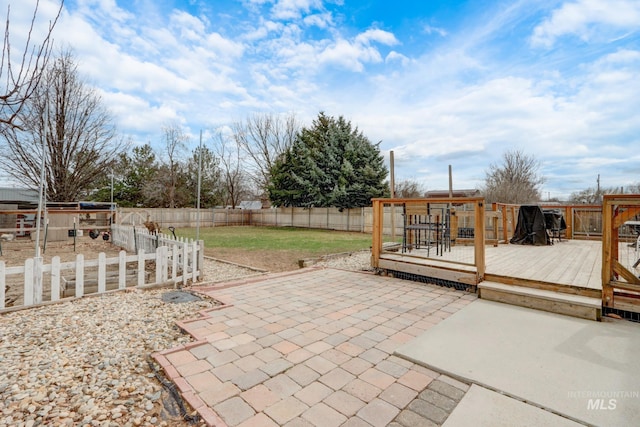 view of patio with a wooden deck and a fenced backyard