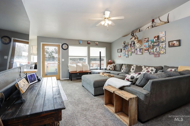 living room featuring a ceiling fan and carpet floors