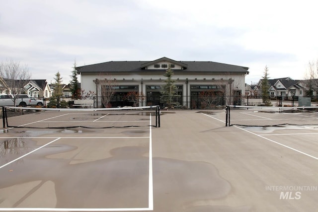 view of sport court with fence